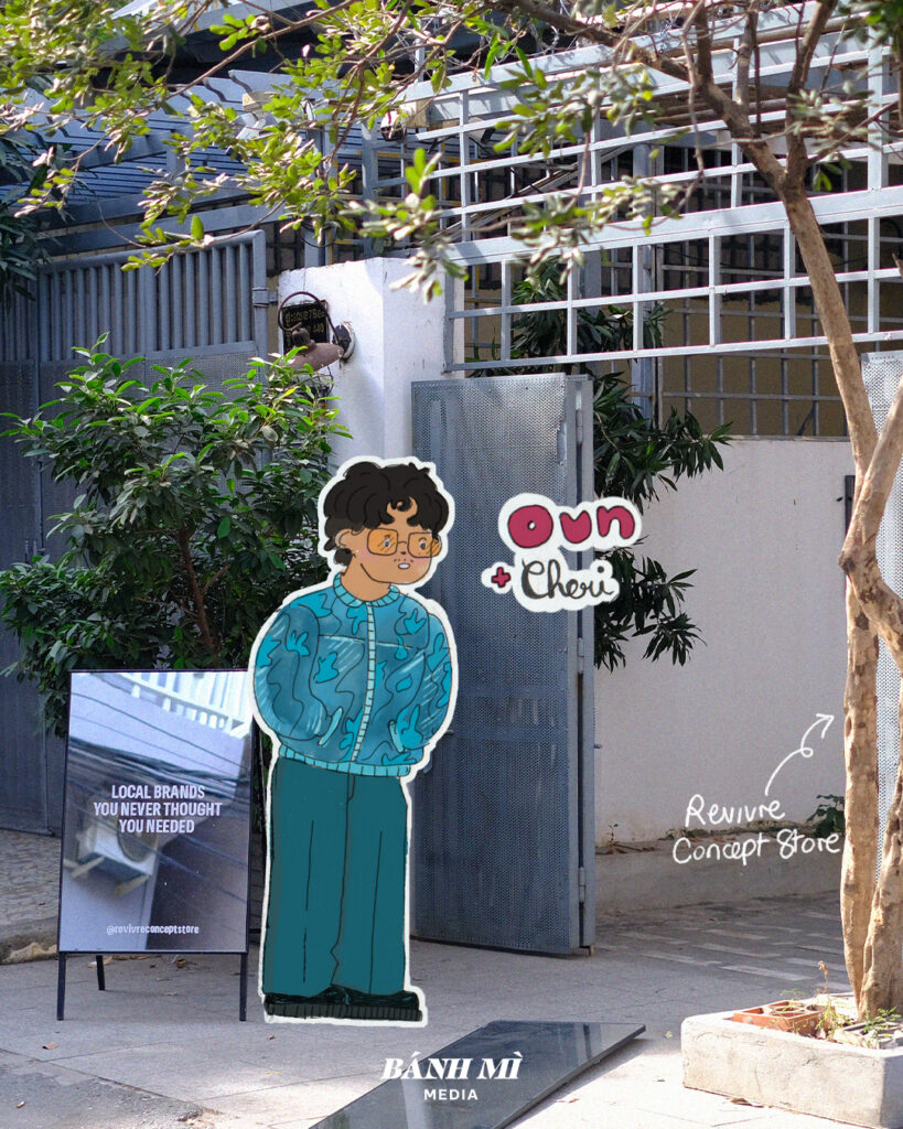 en fond : devanture extérieure de la boutique revivre studio à phnom penh. Avec une illustration d'un homme portant une veste bomber bleue de la marque